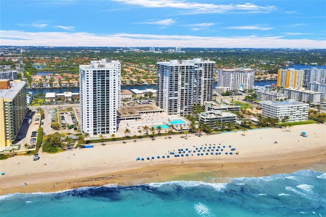 birds eye view of property featuring a water view and a view of the beach