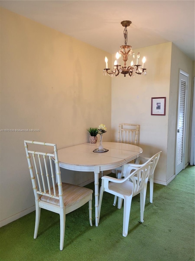 carpeted dining area featuring a notable chandelier