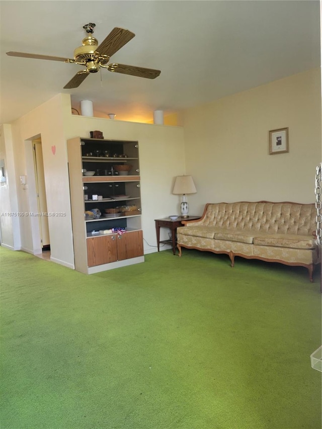 unfurnished living room with ceiling fan and carpet floors