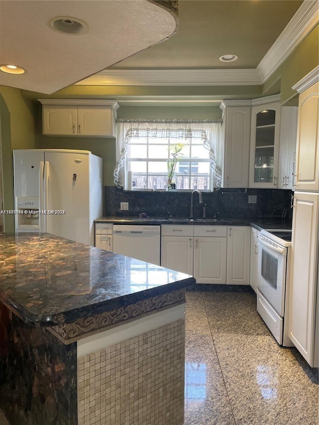 kitchen featuring tasteful backsplash, white appliances, sink, crown molding, and white cabinetry