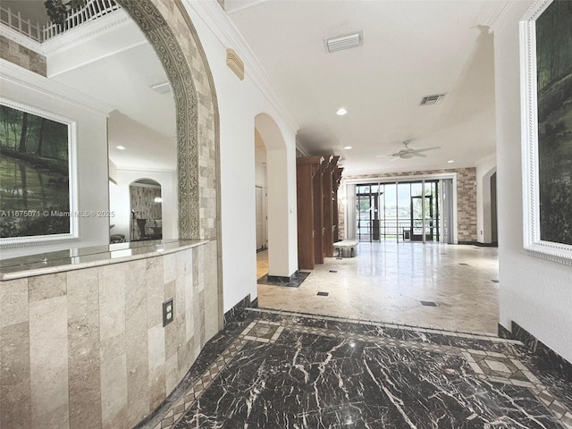 232 SW 7th Ave, Hallandale Beach, FL 33009 - hall featuring ornamental molding, arched walkways, recessed lighting, marble tiled flooring, and baseboards