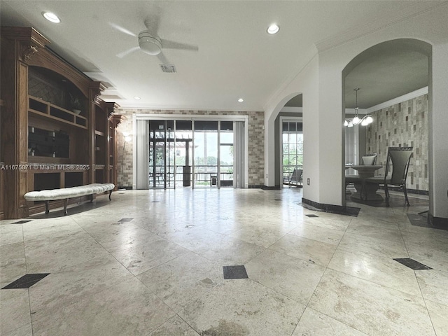 232 SW 7th Ave, Hallandale Beach, FL 33009 - living room featuring arched walkways, crown molding, a ceiling fan, recessed lighting, and a chandelier