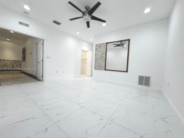 232 SW 7th Ave, Hallandale Beach, FL 33009 - unfurnished room featuring ceiling fan, baseboards, recessed lighting, and marble look tile flooring
