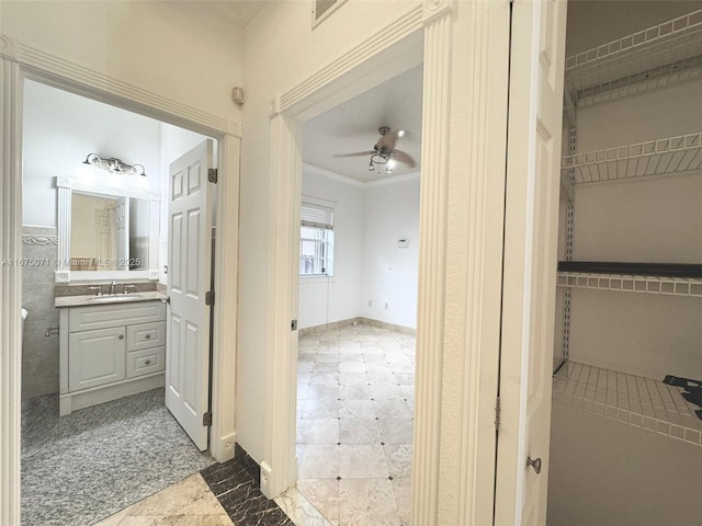 232 SW 7th Ave, Hallandale Beach, FL 33009 - bathroom with vanity, ceiling fan, and crown molding