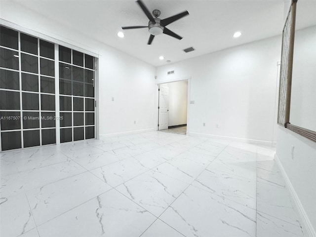 232 SW 7th Ave, Hallandale Beach, FL 33009 - spare room featuring ceiling fan, recessed lighting, baseboards, and marble look tile flooring