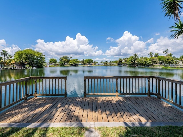 dock area featuring a deck with water view