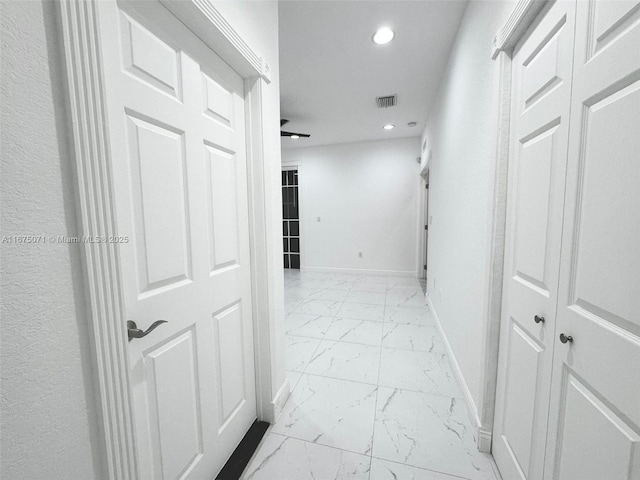 232 SW 7th Ave, Hallandale Beach, FL 33009 - corridor with light marble finish floors, baseboards, and recessed lighting