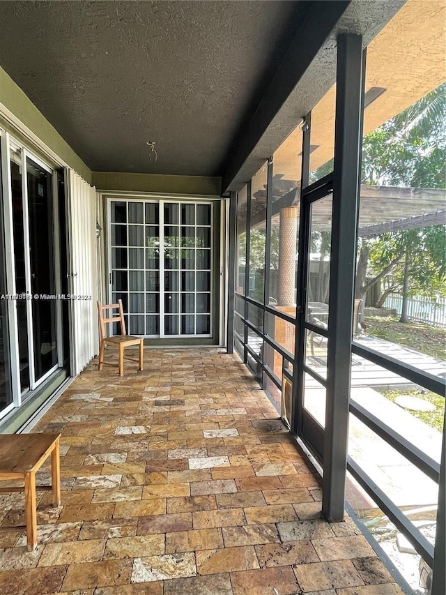 unfurnished sunroom with a healthy amount of sunlight