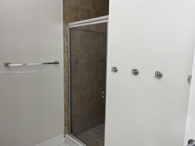 bathroom featuring an enclosed shower