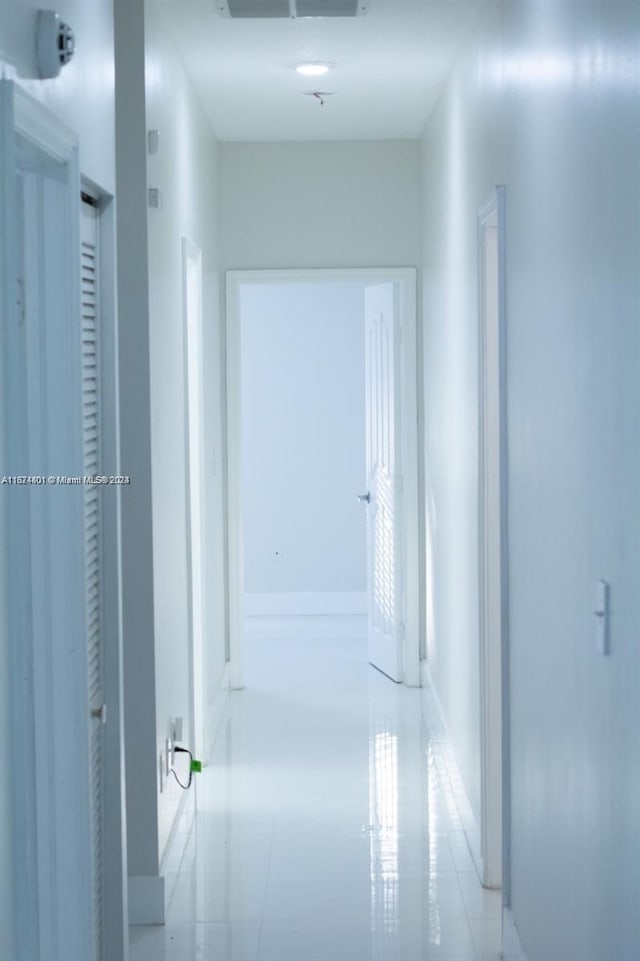 hallway featuring light tile patterned floors