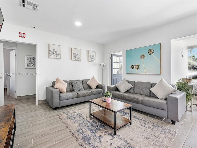 living room with light hardwood / wood-style floors