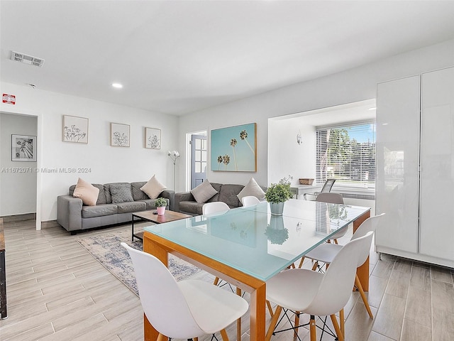 dining room with light hardwood / wood-style floors