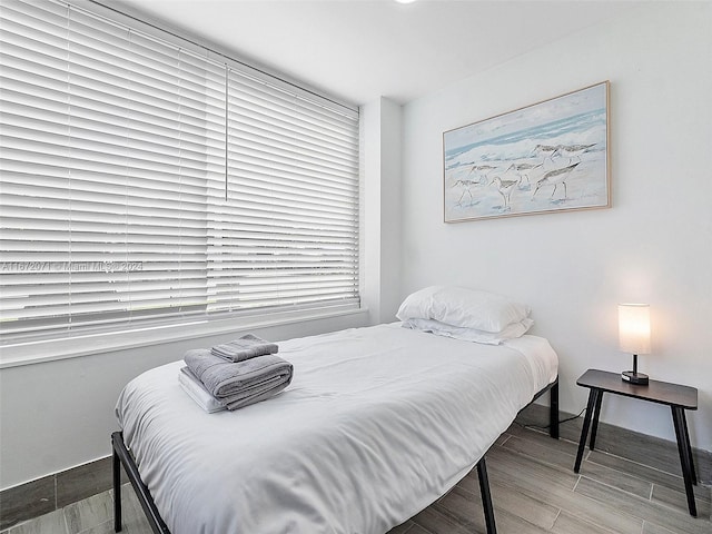 bedroom with wood-type flooring