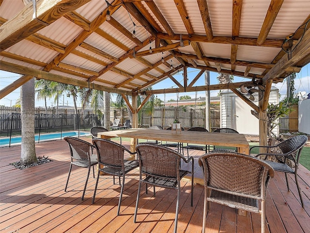 deck featuring a gazebo and a fenced in pool