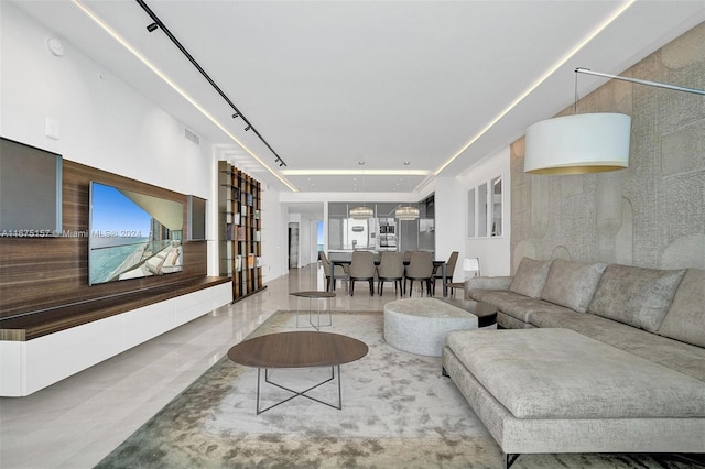 18975 Collins Ave Unit 2001, Sunny Isles Beach, FL 33160 - tiled living room with healthy amount of natural light and rail lighting