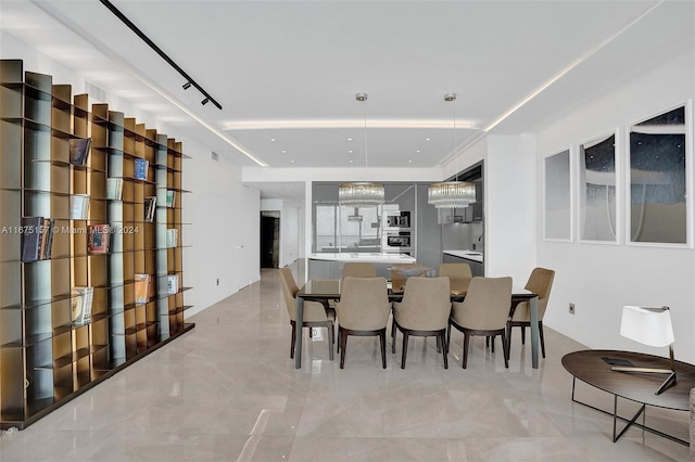 dining area featuring a chandelier