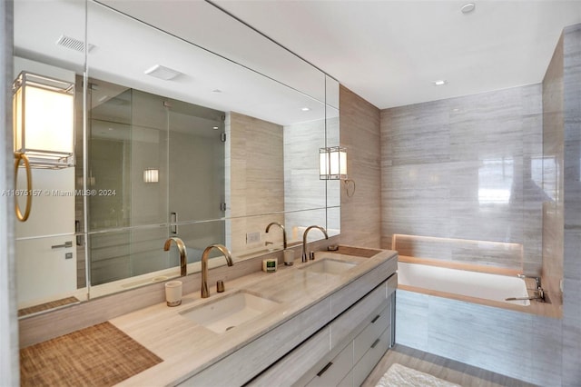 18975 Collins Ave Unit 2001, Sunny Isles Beach, FL 33160 - full bath with double vanity, a garden tub, and tile walls