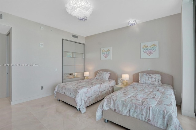 bedroom with a chandelier