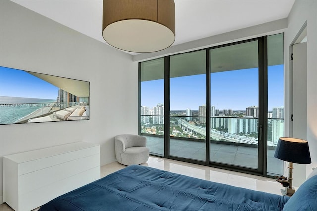 bedroom featuring access to exterior and tile patterned floors