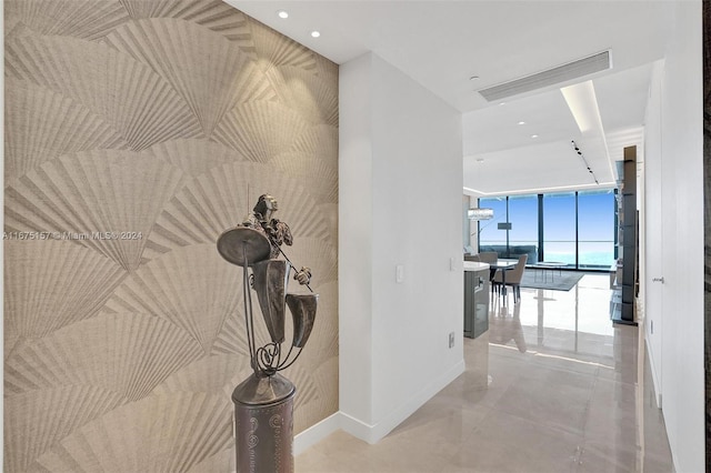 18975 Collins Ave Unit 2001, Sunny Isles Beach, FL 33160 - hall with a wall of windows, baseboards, tile patterned floors, and recessed lighting