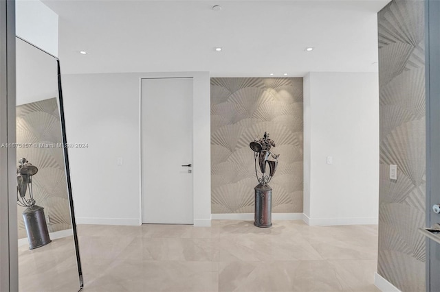 18975 Collins Ave Unit 2001, Sunny Isles Beach, FL 33160 - corridor featuring baseboards, recessed lighting, and an accent wall