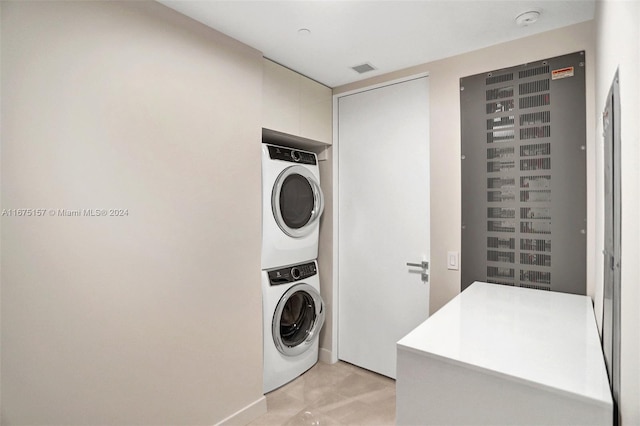 18975 Collins Ave Unit 2001, Sunny Isles Beach, FL 33160 - washroom with stacked washer / drying machine and baseboards
