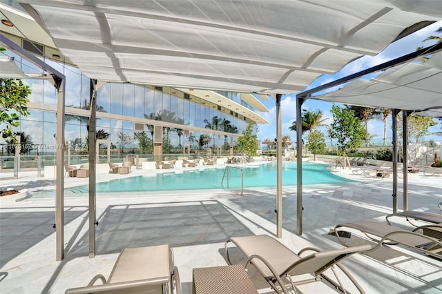 view of swimming pool featuring a patio area