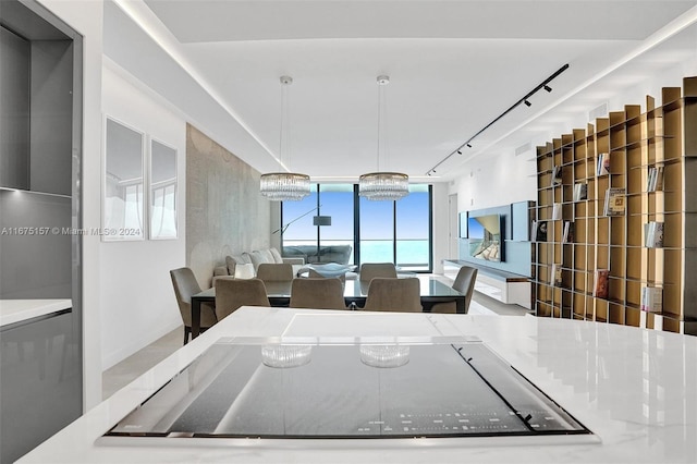 18975 Collins Ave Unit 2001, Sunny Isles Beach, FL 33160 - dining area featuring rail lighting and expansive windows