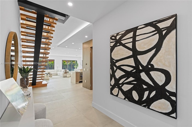 hallway with light tile patterned floors