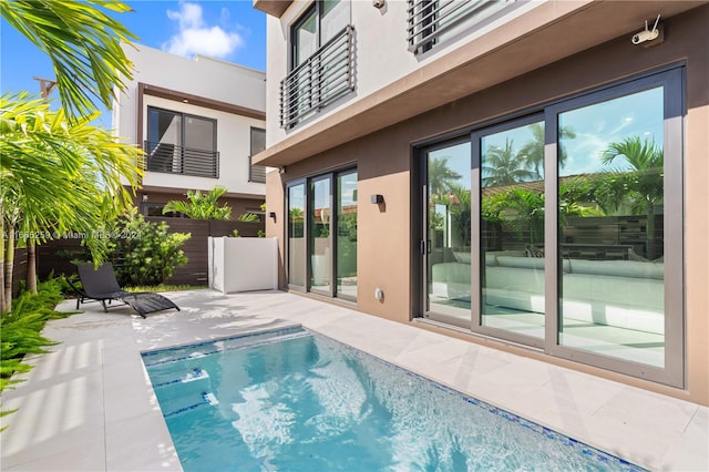 view of swimming pool with a patio