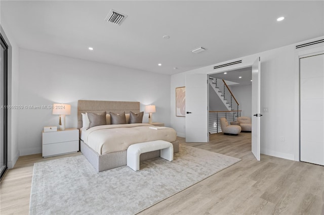 bedroom with light hardwood / wood-style flooring