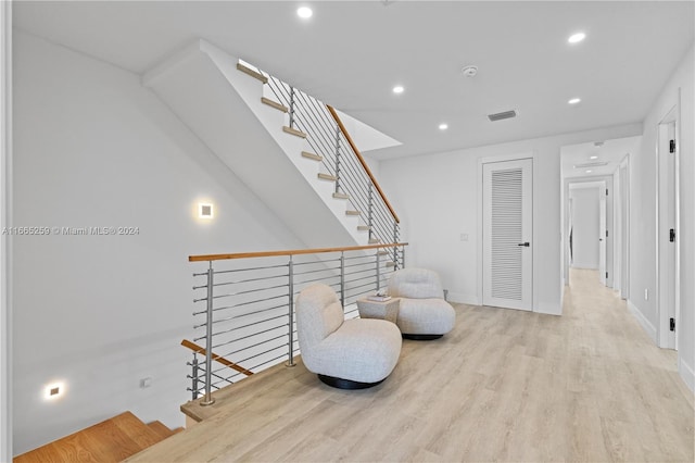 living area with light hardwood / wood-style flooring