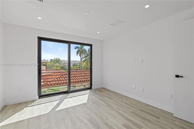 spare room featuring light hardwood / wood-style flooring