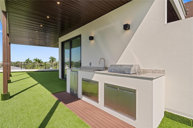 view of patio / terrace featuring area for grilling, an outdoor kitchen, and sink