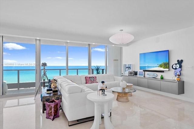 living room featuring a wall of windows