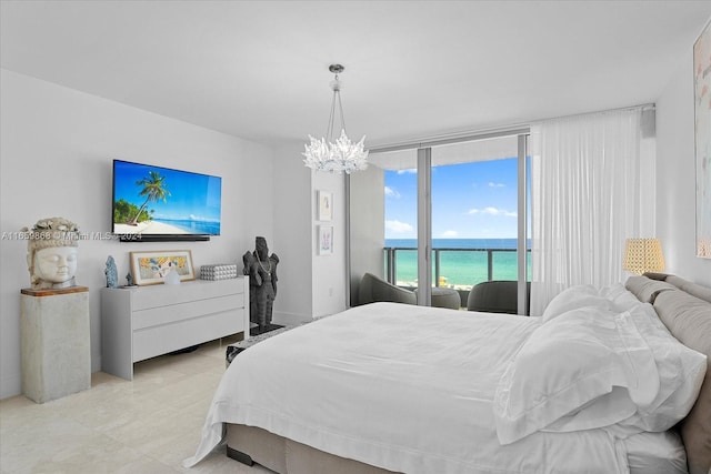 bedroom featuring a notable chandelier and access to outside