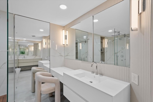 bathroom with vanity and a shower with shower door