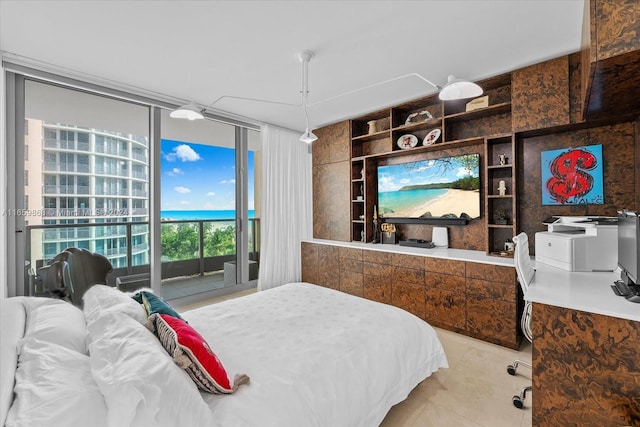 bedroom featuring access to exterior and light tile patterned floors