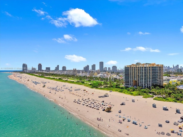 aerial view featuring a water view and a view of the beach