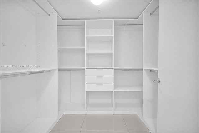 walk in closet featuring light tile patterned floors