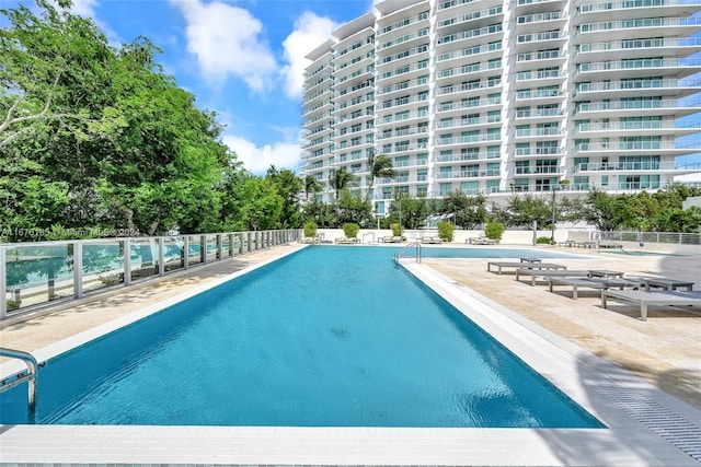 view of swimming pool featuring a patio