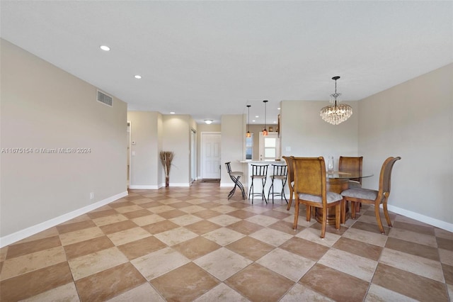 dining space featuring a notable chandelier