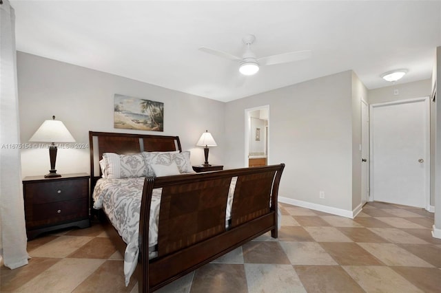 bedroom featuring ensuite bathroom and ceiling fan