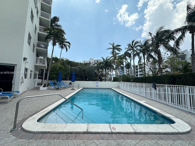 view of swimming pool featuring a patio