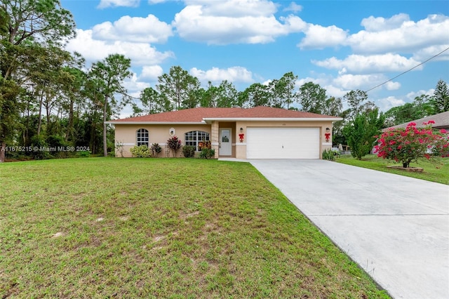 ranch-style house featuring a front lawn and a garage