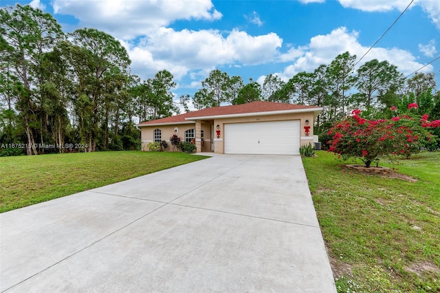 view of front of property with a front yard and a garage