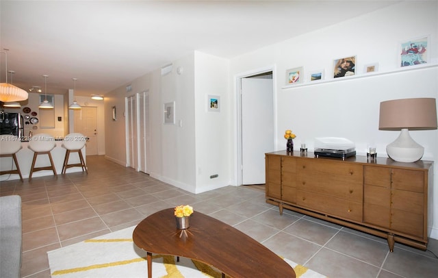 interior space with tile patterned flooring and baseboards