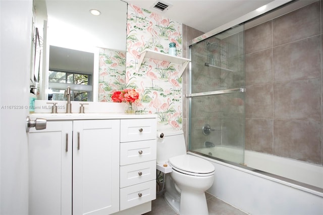 bathroom with toilet, shower / bath combination with glass door, visible vents, vanity, and wallpapered walls