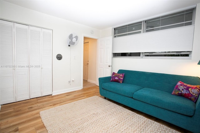 living room with wood finished floors and baseboards