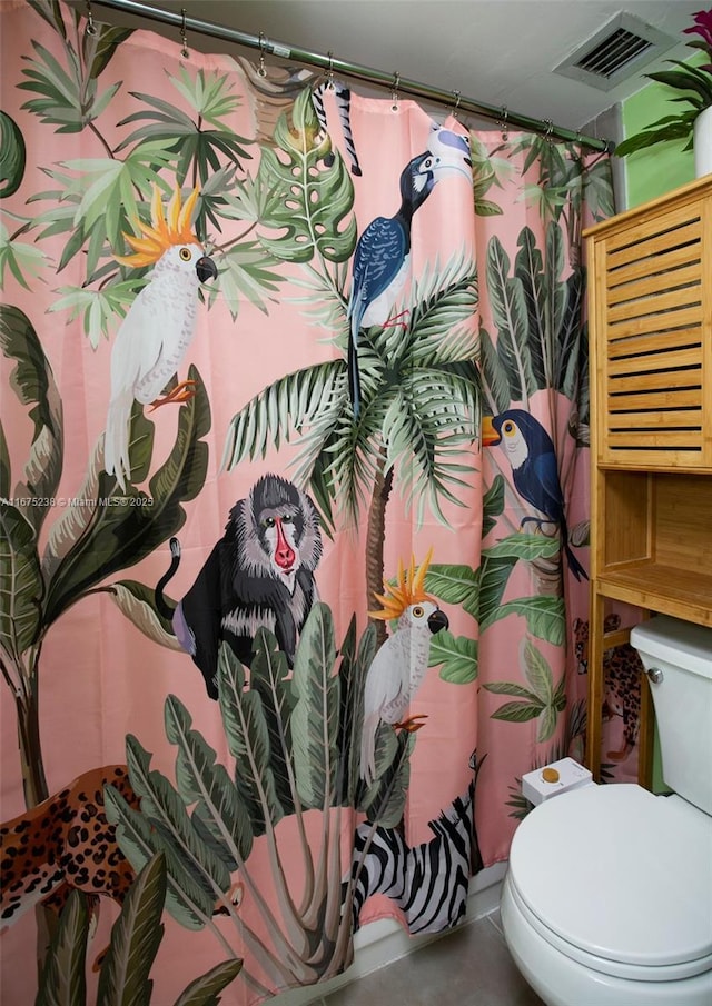 full bathroom featuring visible vents and toilet